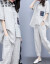 谷語妃のワンピスト女性2019夏NEW韓国版フュージョンが格好いいよ、ユッとした大き目のサズの婦人服の格子のシャシャシャツーのフと洋風の二点セット画像。